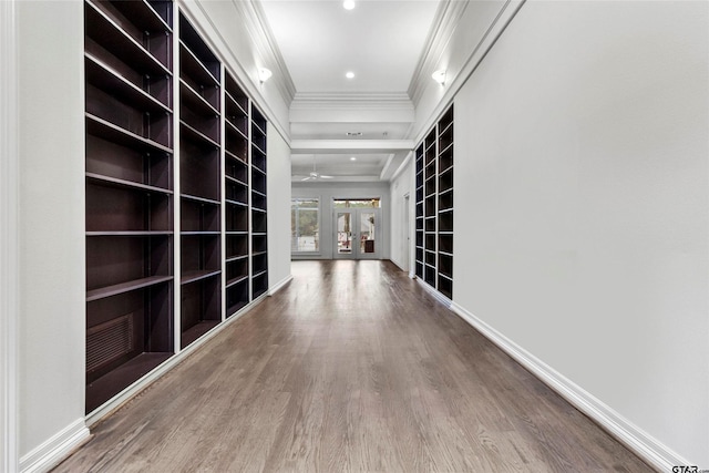 13735 Peninsula Rd, Whitehouse, TX 75791 - corridor with ornamental molding, wood finished floors, built in shelves, and recessed lighting