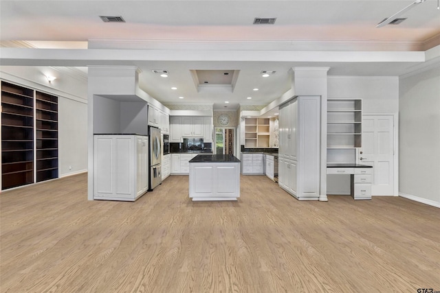 13735 Peninsula Rd, Whitehouse, TX 75791 - kitchen with freestanding refrigerator, ornamental molding, dark countertops, white cabinets, and light wood-style floors