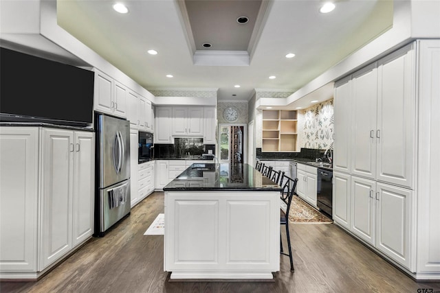 13735 Peninsula Rd, Whitehouse, TX 75791 - kitchen featuring freestanding refrigerator, a kitchen island, a raised ceiling, crown molding, and white cabinets