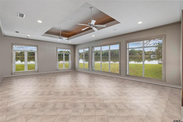 13735 Peninsula Rd, Whitehouse, TX 75791 - spare room with a raised ceiling, ceiling fan, plenty of natural light, a water view, and ornamental molding