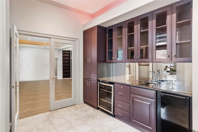 13735 Peninsula Rd, Whitehouse, TX 75791 - kitchen with wine cooler, dishwashing machine, crown molding, light tile patterned floors, and glass insert cabinets