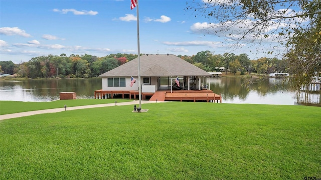 13735 Peninsula Rd, Whitehouse, TX 75791 - back of house featuring a water view, a yard, and roof with shingles