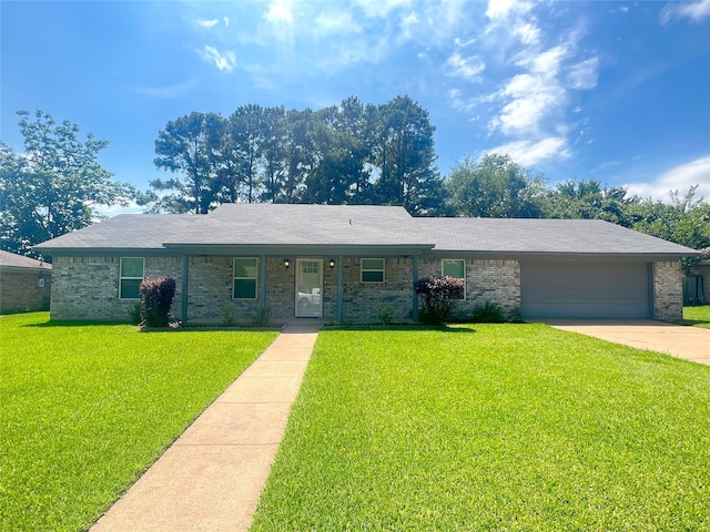 104 Kimberly St, Sulphur Springs, TX 75482 - single story home featuring brick siding, a front yard, concrete driveway, and an attached garage