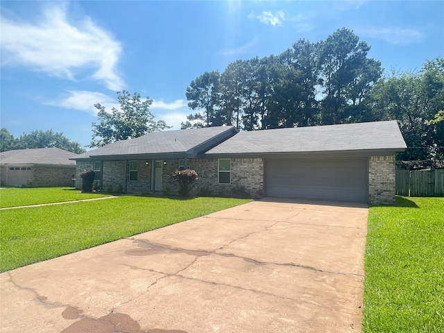 104 Kimberly St, Sulphur Springs, TX 75482 - ranch-style home featuring an attached garage, concrete driveway, and brick siding