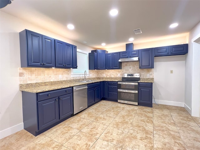 104 Kimberly St, Sulphur Springs, TX 75482 - kitchen with appliances with stainless steel finishes, blue cabinetry, under cabinet range hood, decorative backsplash, and recessed lighting