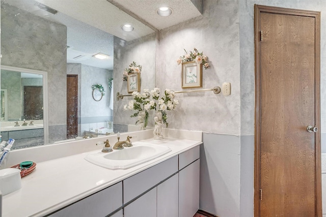 1000 Meadow Hill Rd, Fort Worth, TX 76108 - bathroom with a textured ceiling, vanity, and a closet