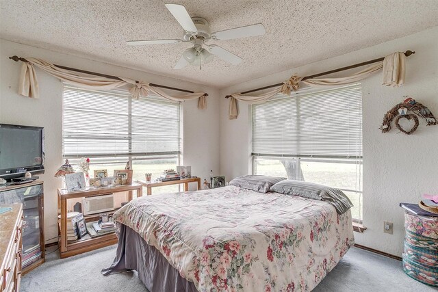1000 Meadow Hill Rd, Fort Worth, TX 76108 - bedroom with a textured ceiling, light colored carpet, multiple windows, a ceiling fan, and a textured wall