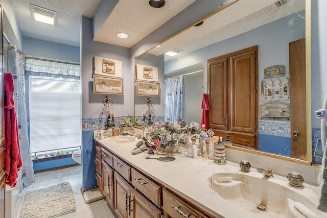 1000 Meadow Hill Rd, Fort Worth, TX 76108 - bathroom featuring double vanity, a textured ceiling, and a shower with curtain