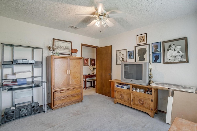 1000 Meadow Hill Rd, Fort Worth, TX 76108 - carpeted living room with ceiling fan and a textured ceiling