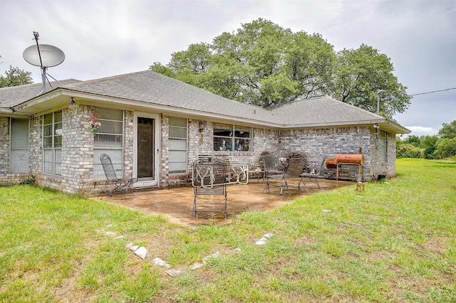 1000 Meadow Hill Rd, Fort Worth, TX 76108 - back of house featuring a patio, a lawn, roof with shingles, and brick siding