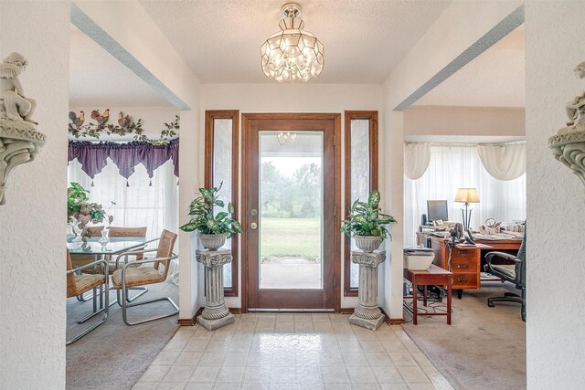 1000 Meadow Hill Rd, Fort Worth, TX 76108 - entryway with a chandelier, a textured ceiling, and a textured wall