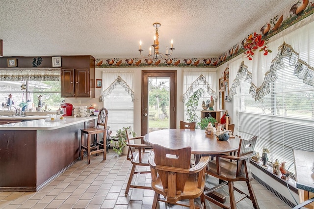 1000 Meadow Hill Rd, Fort Worth, TX 76108 - dining space featuring a textured ceiling and a chandelier