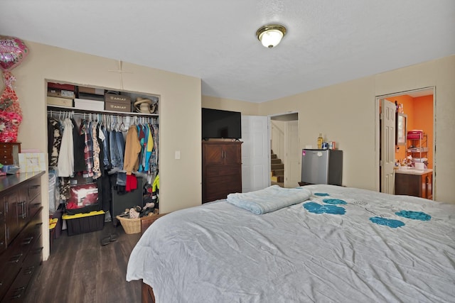 8412 E Fm 917, Alvarado, TX 76009 - bedroom featuring a closet, dark wood finished floors, and ensuite bathroom