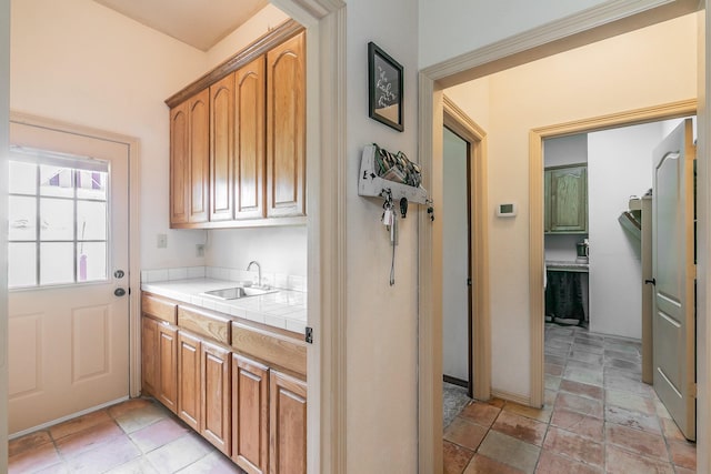 3148 Fm 66, Waxahachie, TX 75167 - laundry area featuring a sink and light stone finish flooring