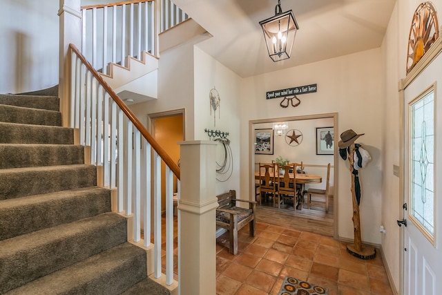 3148 Fm 66, Waxahachie, TX 75167 - foyer entrance featuring stairs, a chandelier, and stone finish flooring