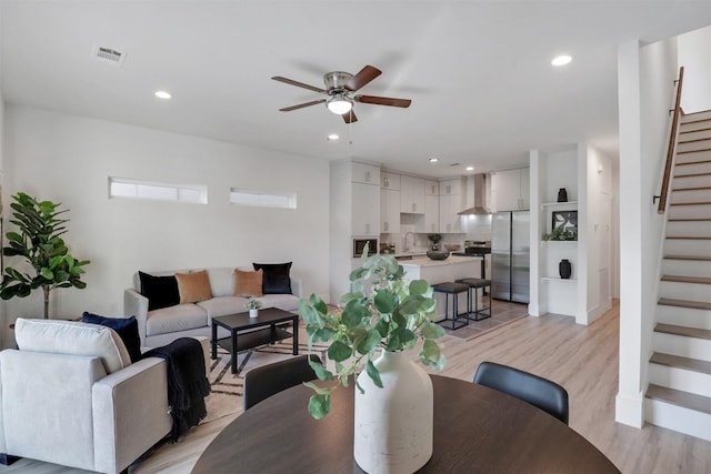 154 S Cisco St, Dallas, TX 75246 - living area with stairs, a ceiling fan, light wood finished floors, and recessed lighting