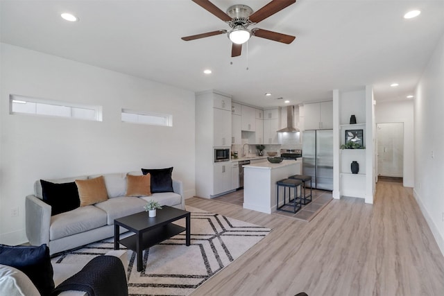 154 S Cisco St, Dallas, TX 75246 - living room with ceiling fan, light wood-style flooring, and recessed lighting