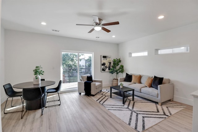 154 S Cisco St, Dallas, TX 75246 - living area with light wood finished floors, a ceiling fan, and recessed lighting