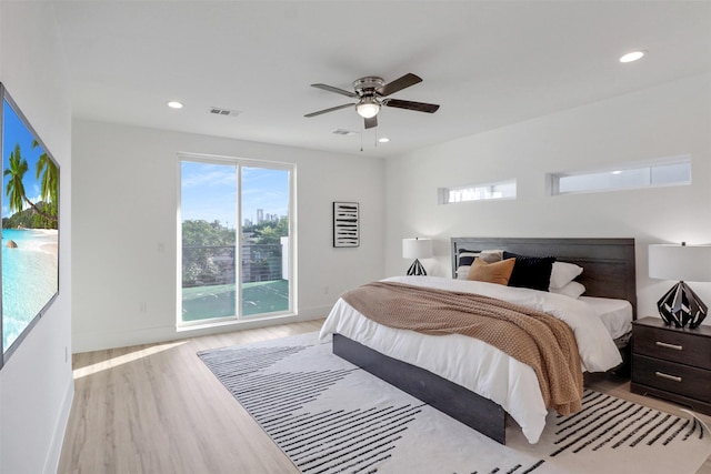 154 S Cisco St, Dallas, TX 75246 - bedroom featuring wood finished floors, access to exterior, recessed lighting, and ceiling fan