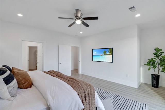 154 S Cisco St, Dallas, TX 75246 - bedroom with light wood-style floors, recessed lighting, and ceiling fan