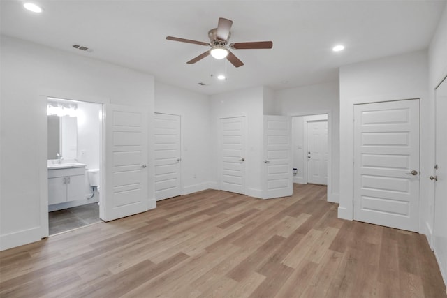 154 S Cisco St, Dallas, TX 75246 - unfurnished bedroom with recessed lighting, light wood-type flooring, ensuite bath, and ceiling fan