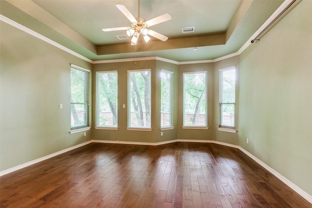 3506 Ash Cir, Richardson, TX 75082 - unfurnished room featuring ceiling fan, dark wood-style flooring, and a raised ceiling