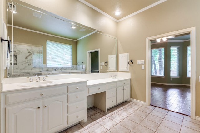 3506 Ash Cir, Richardson, TX 75082 - bathroom featuring double vanity, ornamental molding, plenty of natural light, a marble finish shower, and tile patterned floors