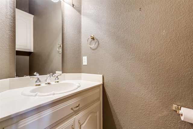3506 Ash Cir, Richardson, TX 75082 - bathroom featuring a textured wall and vanity