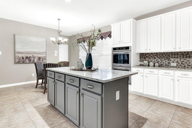 4512 Greenfield Dr, Richardson, TX 75082 - kitchen with gray cabinets, double oven, a chandelier, and white cabinets