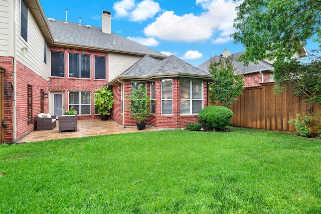 4512 Greenfield Dr, Richardson, TX 75082 - back of house featuring a patio, a chimney, brick siding, roof with shingles, and outdoor lounge area