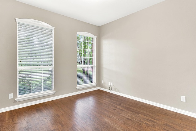 4512 Greenfield Dr, Richardson, TX 75082 - unfurnished room with dark wood-style flooring and baseboards