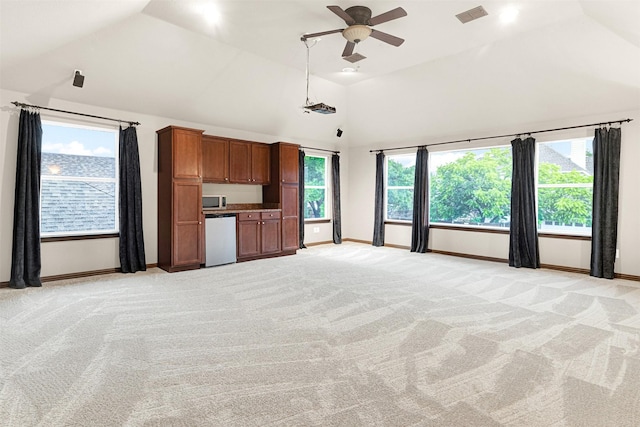 4512 Greenfield Dr, Richardson, TX 75082 - unfurnished living room with a ceiling fan, light colored carpet, plenty of natural light, and high vaulted ceiling