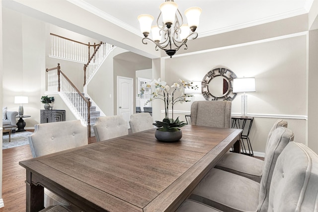 4512 Greenfield Dr, Richardson, TX 75082 - dining space with a chandelier, stairs, ornamental molding, and wood finished floors