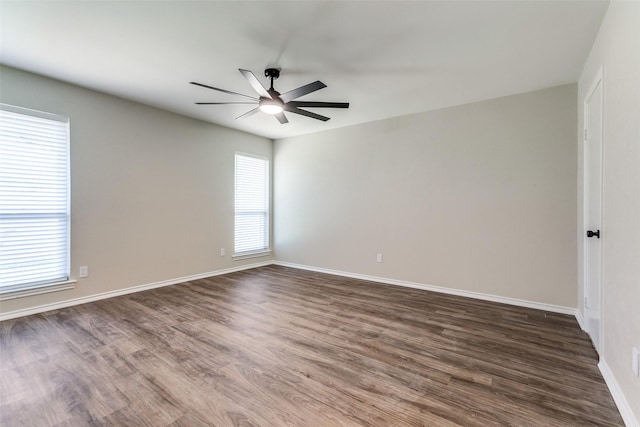 1902 Vassar Dr, Richardson, TX 75081 - unfurnished room with a ceiling fan and dark wood-style floors