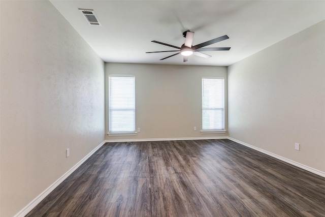 1902 Vassar Dr, Richardson, TX 75081 - empty room with a ceiling fan and dark wood-type flooring