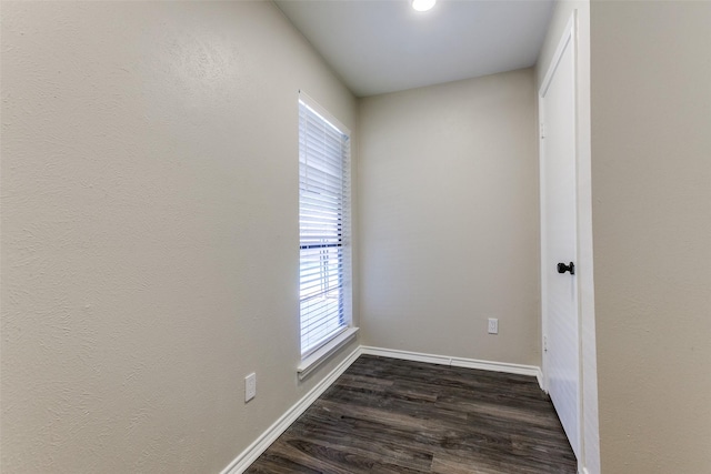 1902 Vassar Dr, Richardson, TX 75081 - unfurnished room with dark wood-type flooring and plenty of natural light