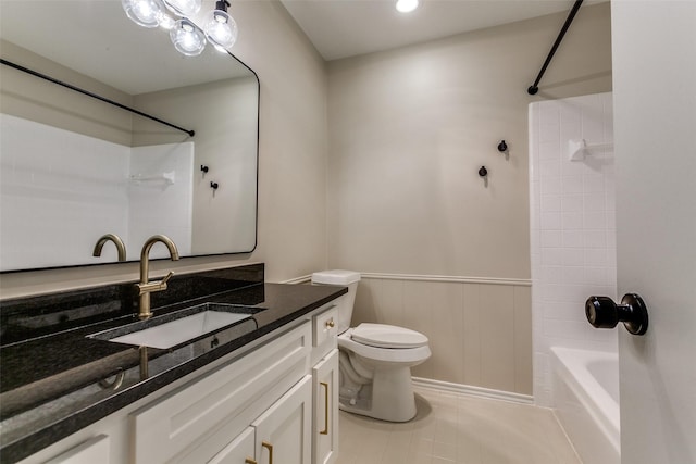 1902 Vassar Dr, Richardson, TX 75081 - bathroom featuring vanity, shower / washtub combination, wainscoting, and tile patterned floors