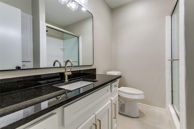 1902 Vassar Dr, Richardson, TX 75081 - bathroom featuring vanity, a shower with shower door, and tile patterned flooring