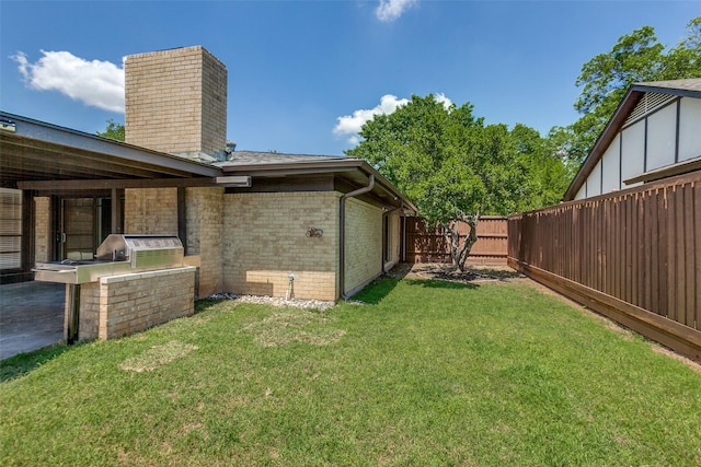 1902 Vassar Dr, Richardson, TX 75081 - fenced backyard featuring area for grilling