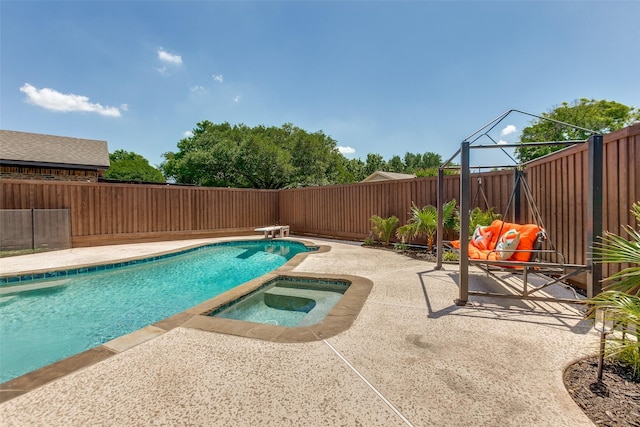 1902 Vassar Dr, Richardson, TX 75081 - view of pool featuring a patio, an in-ground hot tub, a fenced backyard, and a diving board