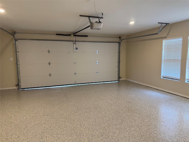 1902 Vassar Dr, Richardson, TX 75081 - garage featuring a garage door opener and baseboards