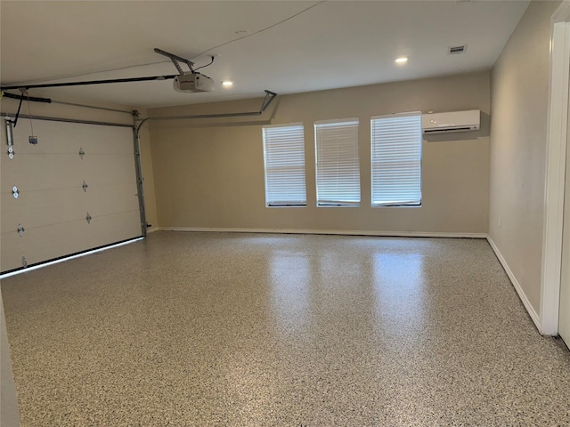 1902 Vassar Dr, Richardson, TX 75081 - garage with a wall mounted air conditioner, a garage door opener, and recessed lighting