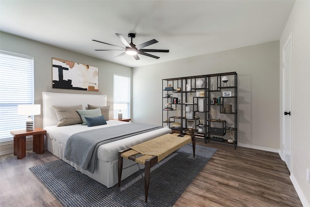 1902 Vassar Dr, Richardson, TX 75081 - bedroom featuring wood finished floors and a ceiling fan