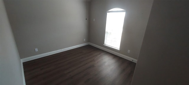 912 Newberry Ln, Royse City, TX 75189 - spare room featuring dark wood-type flooring and baseboards