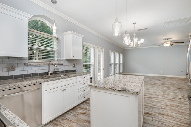 838 Bear Branch Ct, Rockwall, TX 75087 - kitchen with dishwasher, light wood-style floors, ornamental molding, backsplash, and a ceiling fan