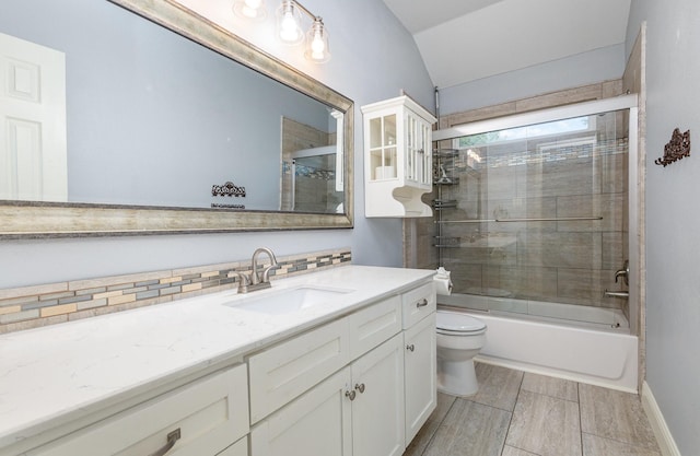838 Bear Branch Ct, Rockwall, TX 75087 - bathroom with vanity, vaulted ceiling, combined bath / shower with glass door, and wood tiled floors