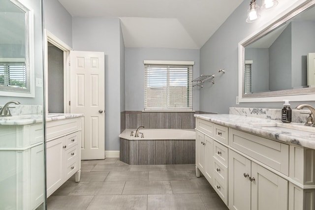 838 Bear Branch Ct, Rockwall, TX 75087 - full bath with two vanities, a bath, and vaulted ceiling