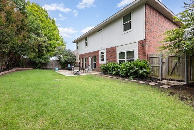 838 Bear Branch Ct, Rockwall, TX 75087 - back of house with brick siding, a patio, and a fenced backyard