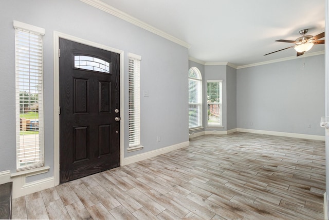 838 Bear Branch Ct, Rockwall, TX 75087 - foyer entrance with wood finished floors, ornamental molding, and a ceiling fan