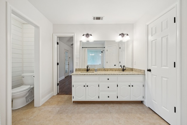 312 Bluffview Ct, Forney, TX 75126 - full bathroom with double vanity and tile patterned floors